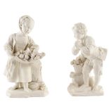 A pair of Sèvres white biscuit figures of a youth and companion,