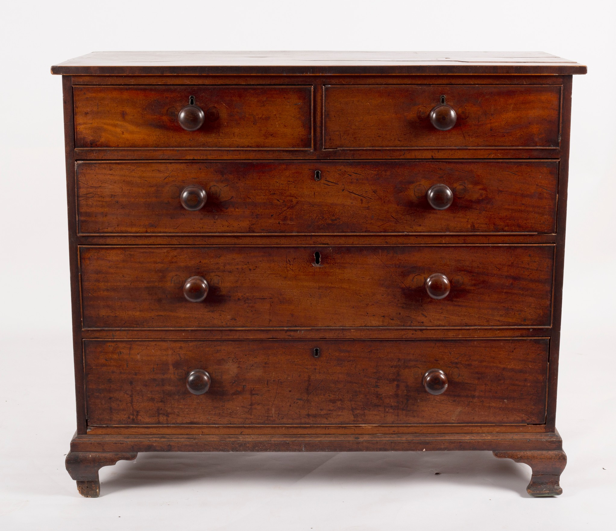 A George III mahogany chest of three long and two short drawers, on ogee bracket feet,