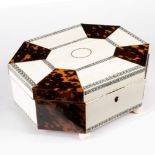 An Anglo-Indian ivory and tortoiseshell work box, the hinged cover of alternating panels,