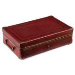 A gentleman's red leather travelling dressing case,
