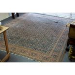 A Ferahan carpet, the central field decorated all over flowers within a stylised figured border,