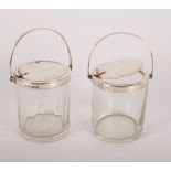 A near pair of silver mounted jam jars, Birmingham 1928 and Birmingham 1905,