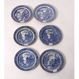 A pair of Staffordshire blue and white willow pattern plates and four others