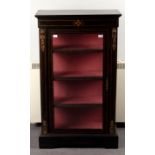 A Victorian ebonised display cabinet enclosed by a glazed door and glazed sides,