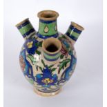 A 20th Century Middle Eastern glazed earthenware tulip vase, 24.
