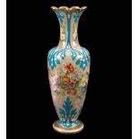 A large French opaline glass vase, circa 1840, painted with luxuriant flowers on a buff ground,