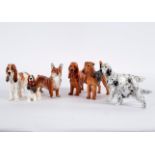 Seven Royal Doulton figures of dogs, including English setter, spaniel,
