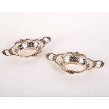 A pair of small silver two-handled trays, WC/JL, London 1898,