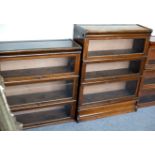 A Globe Wernicke three-section bookcase, 86.5cm wide, another two, 86.