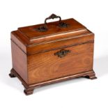 A George III mahogany tea caddy, with handle to cover, on ogee bracket feet, 15cm x 25.