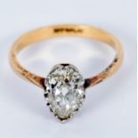 A diamond ring, the single pear-shaped stone approximately 1ct,