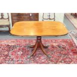 A mid 19th Century mahogany rectangular breakfast table, on a turned column and quadruple support,