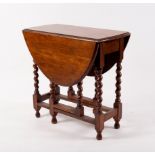 A small oak gateleg table on barley twist legs,