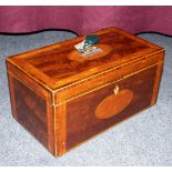 A Georgian mahogany tea caddie, cross banded in satinwood, fitted three compartments,