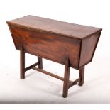 An 18th Century dough bin, the tapered bin on square legs with stretchers,