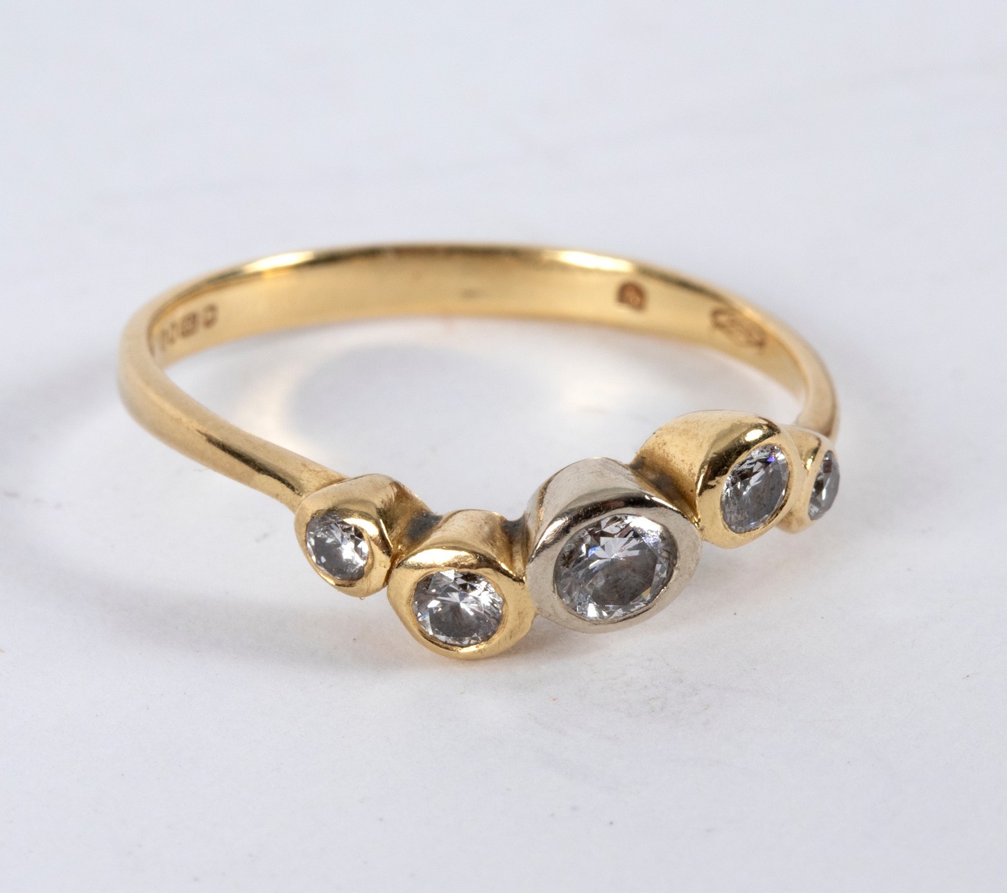 A diamond five-stone ring of modern design,