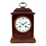 A mahogany arched mantel clock, circa 1920,