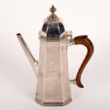 An early 18th Century style silver coffee pot, London 1907, of tapering square canted shape,