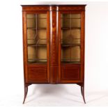 An Edwardian mahogany and inlaid display cabinet with glazed panel doors flanked by an inlaid