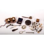 A quantity of thimbles, including silver examples, two pieces of silver filigree,