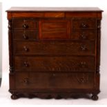A Victorian oak chest of five short and three long drawers on turned feet,
