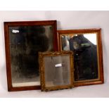 Two mirrors each in maple frames,