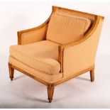 A satinwood framed armchair with upholstered back,