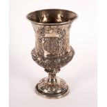 A Victorian silver goblet, London 1863, with armorial to side, 17cm high,