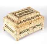 A 19th Century bone box with fretwork decorated panels, (locked),