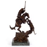 After Frederic Remington a bronze model of an Indian attending a panther on horseback,