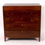 An early 19th Century chest of four long drawers,