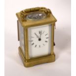 A gilt brass cased carriage clock with striking movement, the back plate stamped 6524, 16cm high,