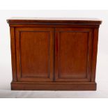 A Victorian mahogany side cabinet, enclosed by panel doors on a plinth base,