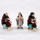 Two Derby figures of seated friars and a figure of a nun, circa 1760, one monk with incised no.