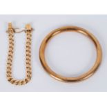 A gold bracelet of flattened curb links and a circular bangle, Henry Griffith & Sons,