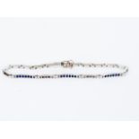 A sapphire and diamond bracelet with three channel set sapphire links and two diamond set links,