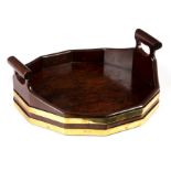 A George III mahogany brass bound tray with two pierced handles,