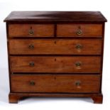 A George III mahogany chest of two short and three long graduated cock beaded drawers,