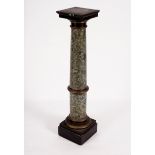 A faux marble plinth of tapered column form,