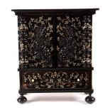 An early 19th Century Monghyr ebony and ivory inlaid table cabinet,
