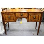 A Regency mahogany sideboard of small proportions, fitted three drawers on square tapering legs,