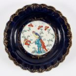 A Worcester Sir Joshua Reynolds pattern Kakiemon plate, painted a central bird within a blue border,