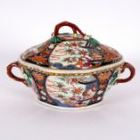 A Worcester tureen and cover, circa 1770, painted a pavilion pattern with twig handles,