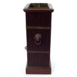 A mahogany stick stand, circa 1900, with reeded sides and brass bands,