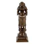 An Indian bronze oil lamp figure, Lakshmi, 19th Century,