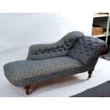 A Victorian upholstered daybed with deep buttoned upholstery on turned legs,