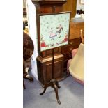 A late 19th Century pole screen with rectangular wool work panel