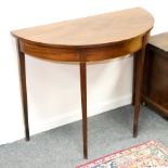 A semi-elliptical side table, circa 1790, on square tapering legs,