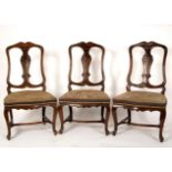 Three Dutch beech framed chairs with cartouche-shaped backs and upright splats above needlework