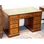 A late 19th Century mahogany twin-pedestal desk, stamped W M Morris to the drawers,